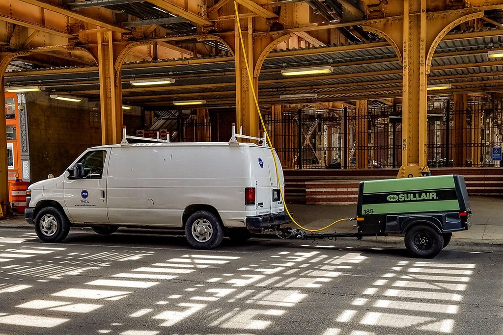 Sullair 185 portable diesel air compressor on a job site